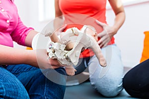 Explaining birth process with anatomic model of pelvic bones