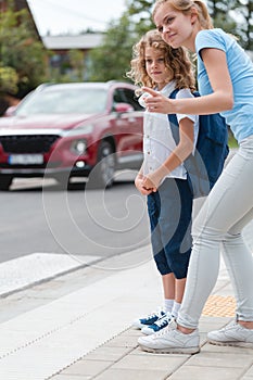 Explains to the little boy how to cross the street safely photo