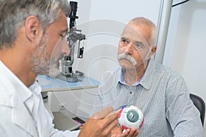 Explanation about eye disease to patient photo