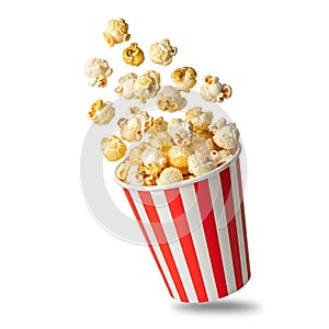 Exploding popcorn in a red and white striped bucket