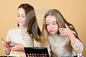 Explore moms cosmetics bag concept. Salon and beauty treatment. Children little girls make up face. Makeup store