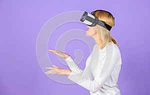 Explore virtual reality. Digital device and modern opportunities. Woman head mounted display violet background. Virtual