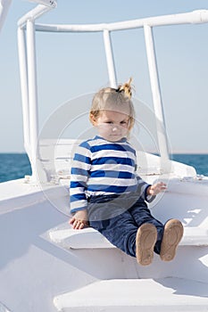 Explore world. Child cute sailor on yacht sunny day. Adventure of boy sailor travelling sea. Boy adorable sailor striped