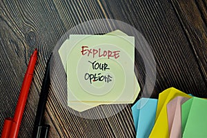 Explore Your Options write on sticky note isolated on Wooden Table