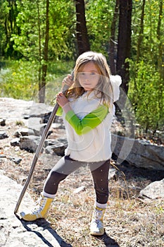 Explorer blond kid girl sith stick and winter white fur