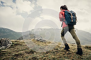 Explorer girl going up on mountain.