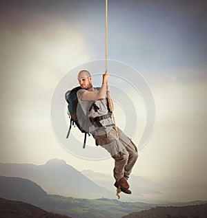 Explorer hanging from a rope