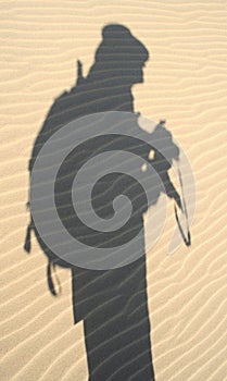 Explorer's shadow in sand, Nam