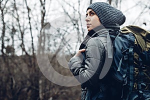 Explorer Young woman With Backpack Walking In Forest, Rear view. Adventure Bushcraft Survival Scouting photo