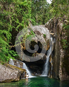 Exploring the Hidden Waterfall Cave in the Tropical Rainforest