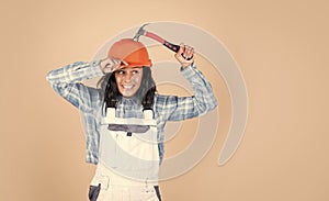 exploring tools. female worker. Architecture. woman architect in helmet. girl in checkered shirt and protective hard hat