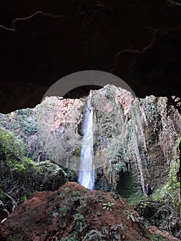 Exploring the waterfall under the rocky mountain!