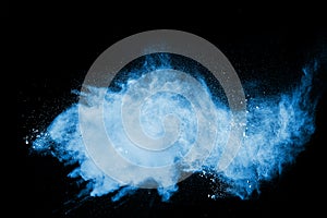 The explosion of blue colored powder. Beautiful blue color powder fly away
