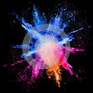 Explosion of colorful powder on a black background