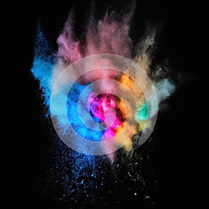 Explosion of colorful powder isolated on dark black background. Holi paint color dust explode in freeze motion. Generative AI