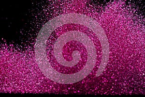 Explosion metallic pink glitter sparkle. Choky Glitter powder spark blink celebrate, blur foil explode in air, fly throw pink photo