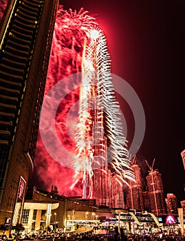 Explosion of multi-colored fireworks at Burj Khalifa Dubai against the night sky on a new year celebrations holidays in Dubai, UAE