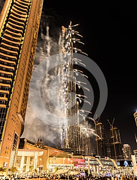 Explosion of multi-colored fireworks at Burj Khalifa Dubai against the night sky on a new year celebrations holidays in Dubai, UAE