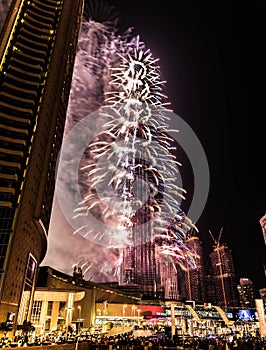 Explosion of multi-colored fireworks at Burj Khalifa Dubai against the night sky on a new year celebrations holidays in Dubai, UAE