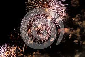 Explosion of multi-colored fireworks in Dubai against the night sky on a new year celebrations holidays