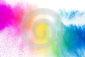 Explosion of rainbow color powder on white background.