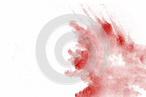 Explosion of red dust on white background