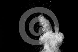 Explosion of white dust on black background.