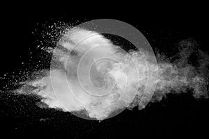 Explosion of white dust on black background.