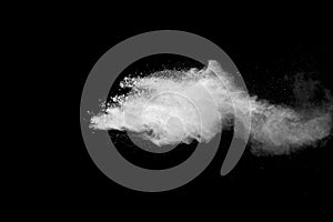 Explosion of white dust on black background.