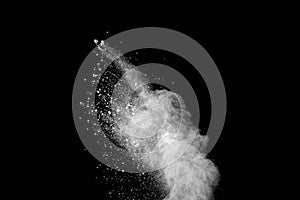 Explosion of white dust on black background.