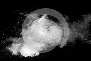 Explosion of white dust on black background.