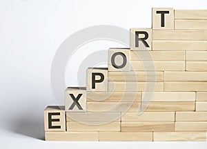 EXPORT Word Written In Wooden Blocks on white background photo