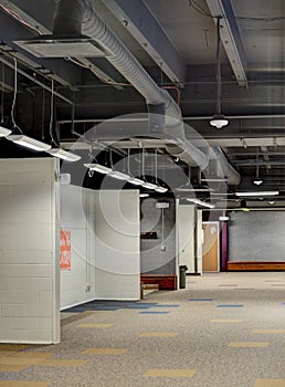Exposed duct work in the ceiling of a school