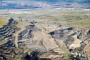 The exposed ground surface mine, in the background wall bunk down with lignite