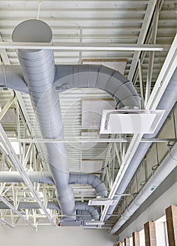 Exposed HVAC duct work in a modern elementary school.