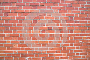 Exposed red brick wall texture as background and design element
