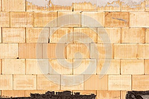 An exposed wall with red bricks