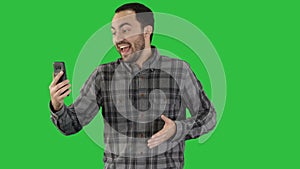 Exprecive talk on the phone of a man Videoblog, blog, vlog on a Green Screen, Chroma Key.