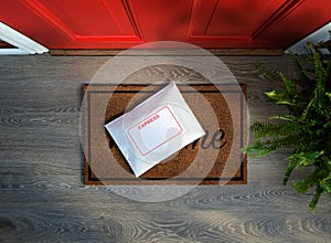 Express courier package delivered outside front door.