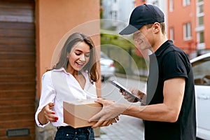 Express Delivery Service. Courier Delivering Package To Woman