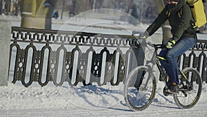 Express food delivery by bike during lockdown and coronavirus epidemic. Man in protective mask with yellow thermo