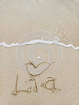 Express Love Lia, name on the sand