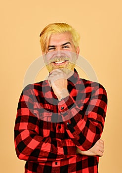 Expression of inner you. Moisturise and apply beard oils. Handsome man unshaven face. Bearded man checkered shirt photo