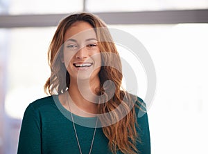 An expression of job satisfaction. Cropped portrait of a confident and attractive young businesswoman.