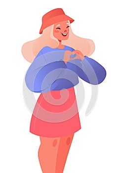 Expression of love, romantic symbol, gesture. Happy girl expresses love with her hands