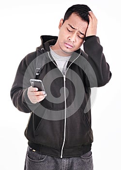 Expression of a man who was sad when the phone