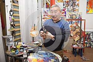 Expressionist artist in his art studio