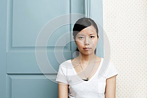 Expressionless Asian young woman