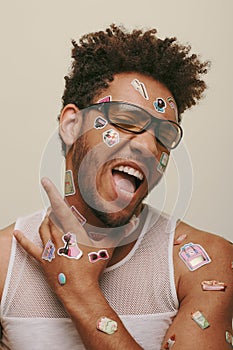 expressive african american fella in sunglasses photo