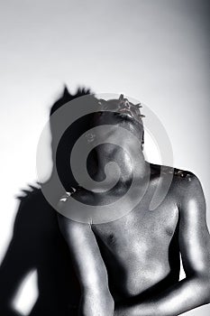 Expressive Emotions. Drama. Silver-plated Man posing. Creativity photo